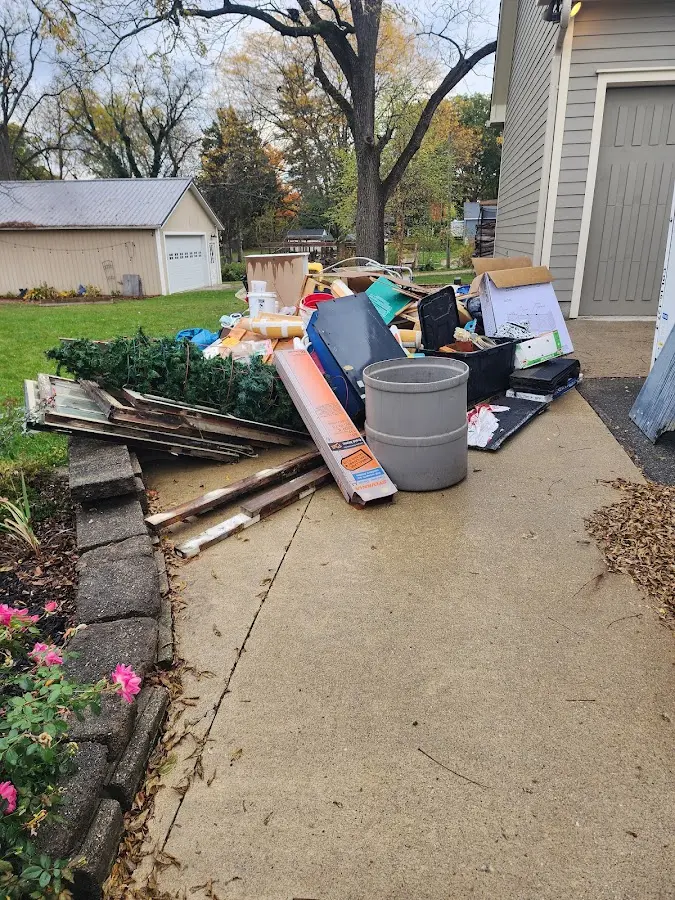Dumpster being loaded with debris for 30 Yard Dumpster Rental in Hialeah Gardens
